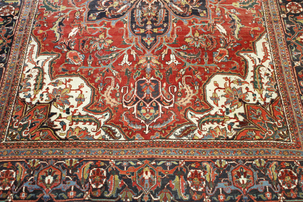 Blue & Red Tribal Antique Heriz Con Dav rug in room setting
