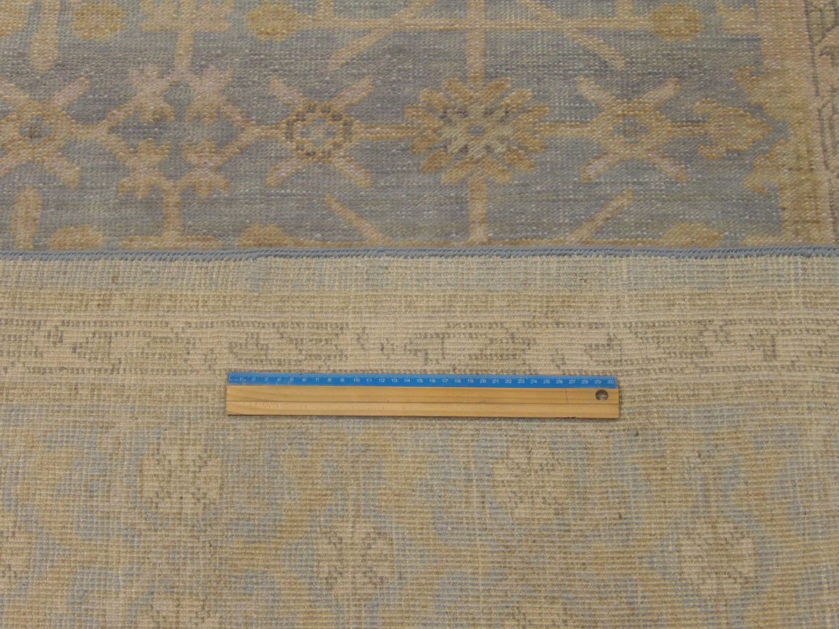 Blue & Gold Khotan Chobi Wash rug in room setting