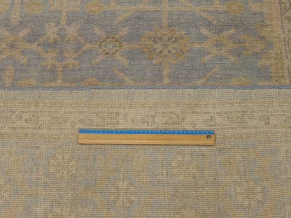 Blue & Gold Khotan Chobi Wash rug in room setting