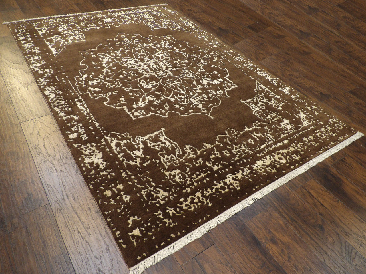 Brown and gold Broken Heriz rug in a living room setting
