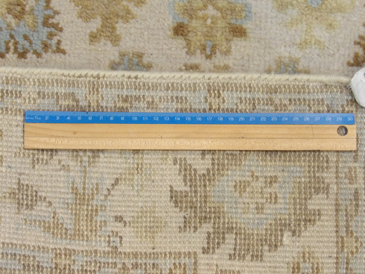 Ivory Oushak rug in room setting