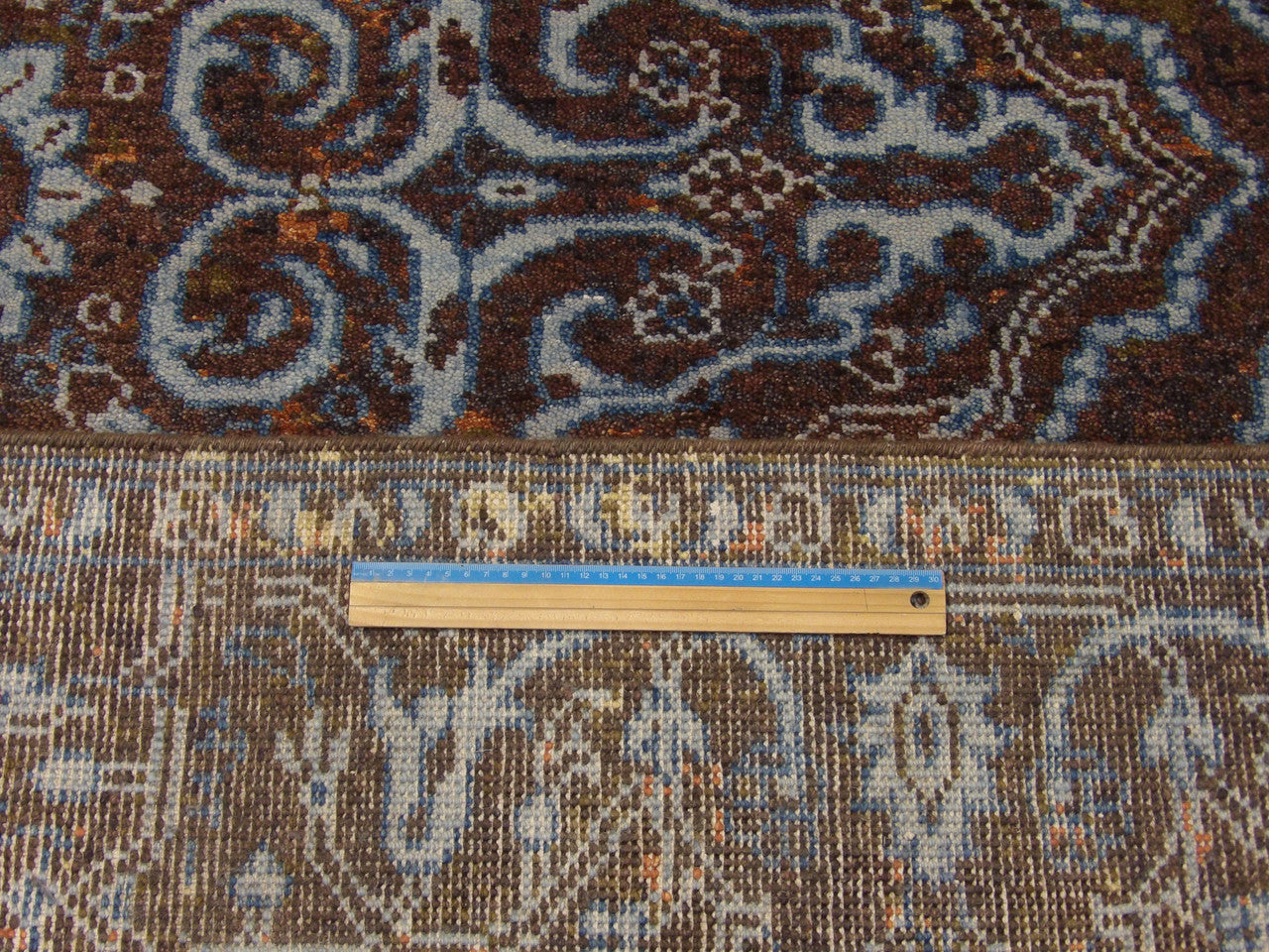 Blue & Brown Colorful Persian Design High Low Broken rug in room setting