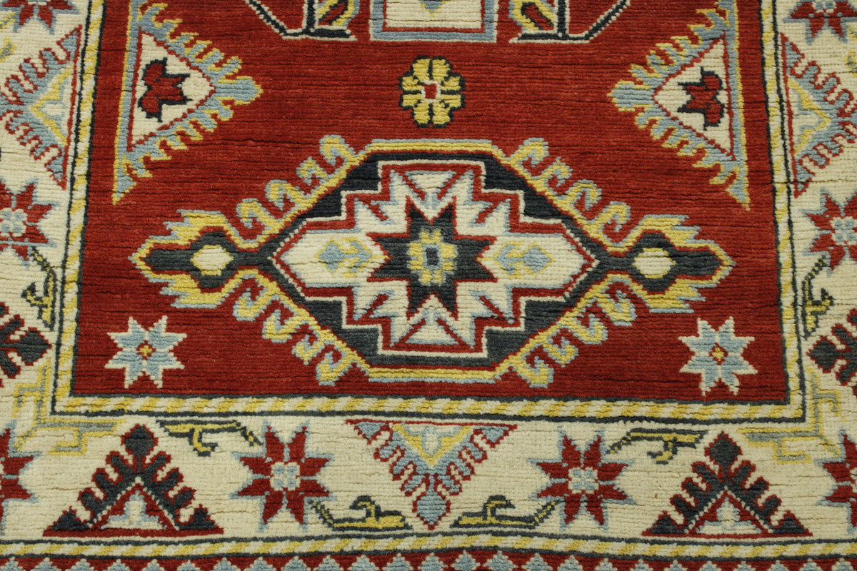 Tribal Super Kazak rug corner detail