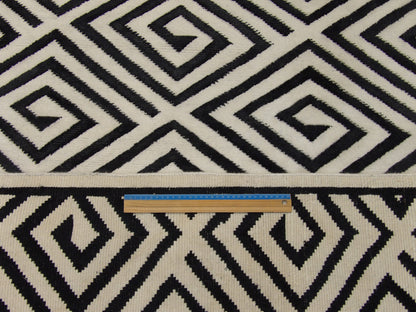 Black and white Tibetan rug in room setting