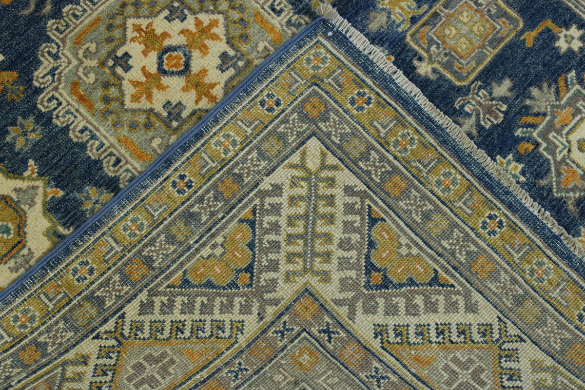 Blue & Beige Tribal Super Kazak rug in room setting