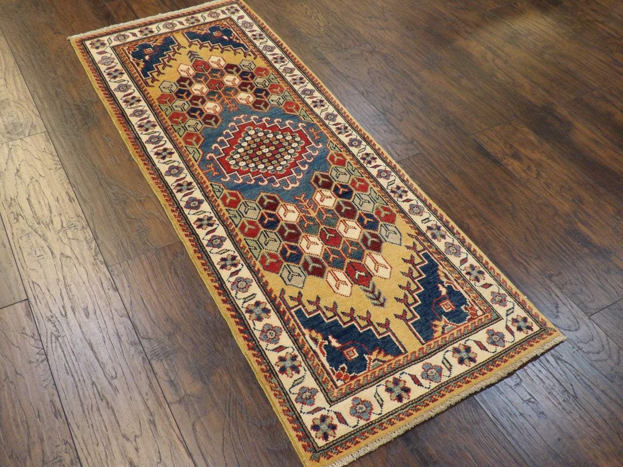 Tribal Kazak rug corner detail