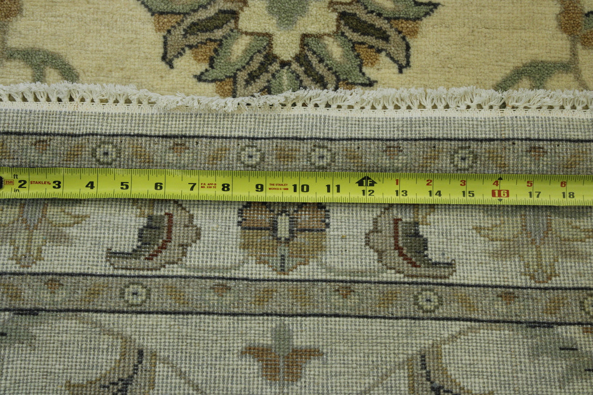 Beige Oushak Indo Ziegler rug in room setting