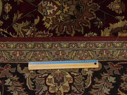 Black & Red Fine Persian Kashan rug in room setting