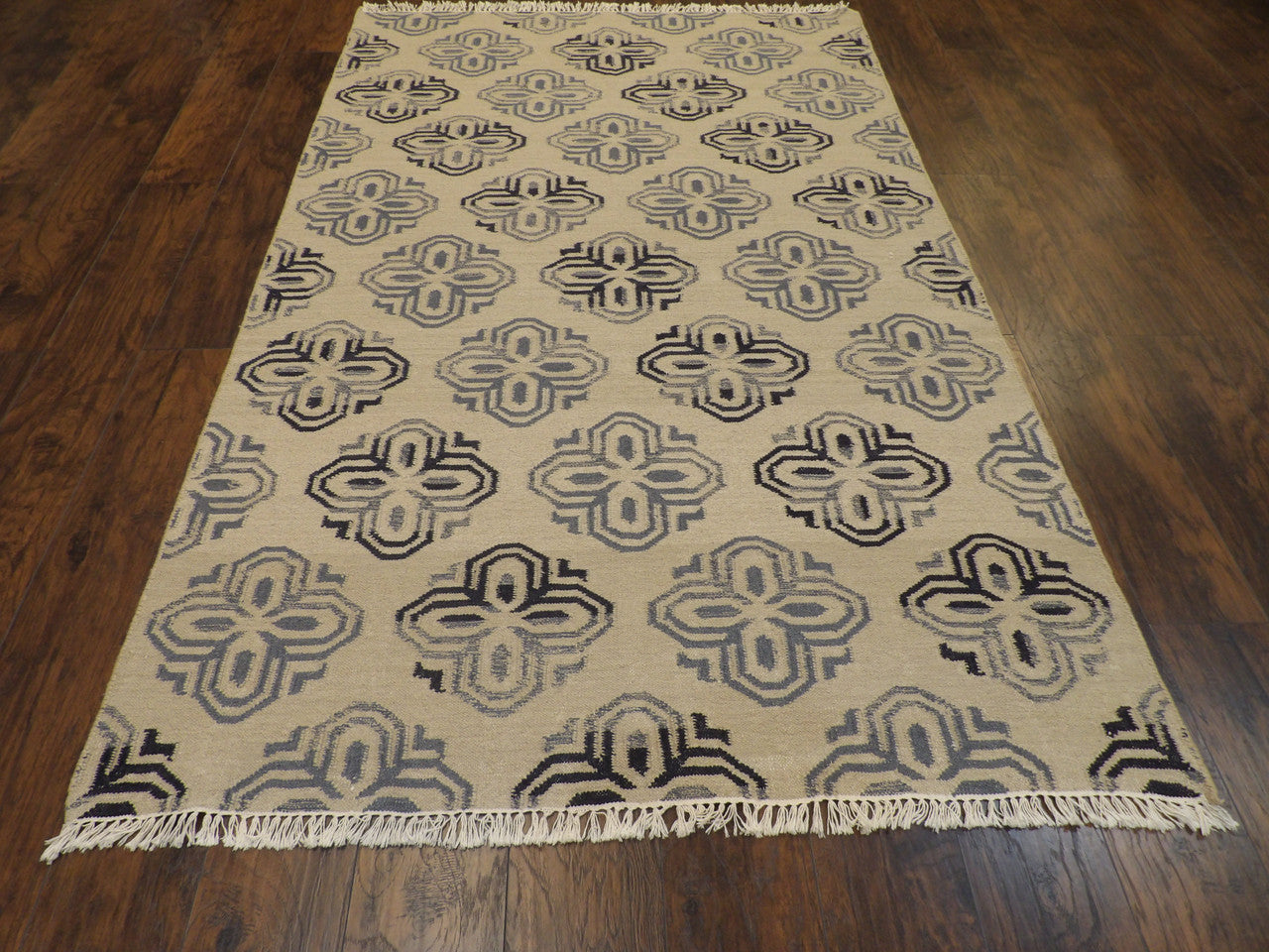 Back of hand-knotted coastal rug showing reversible weave