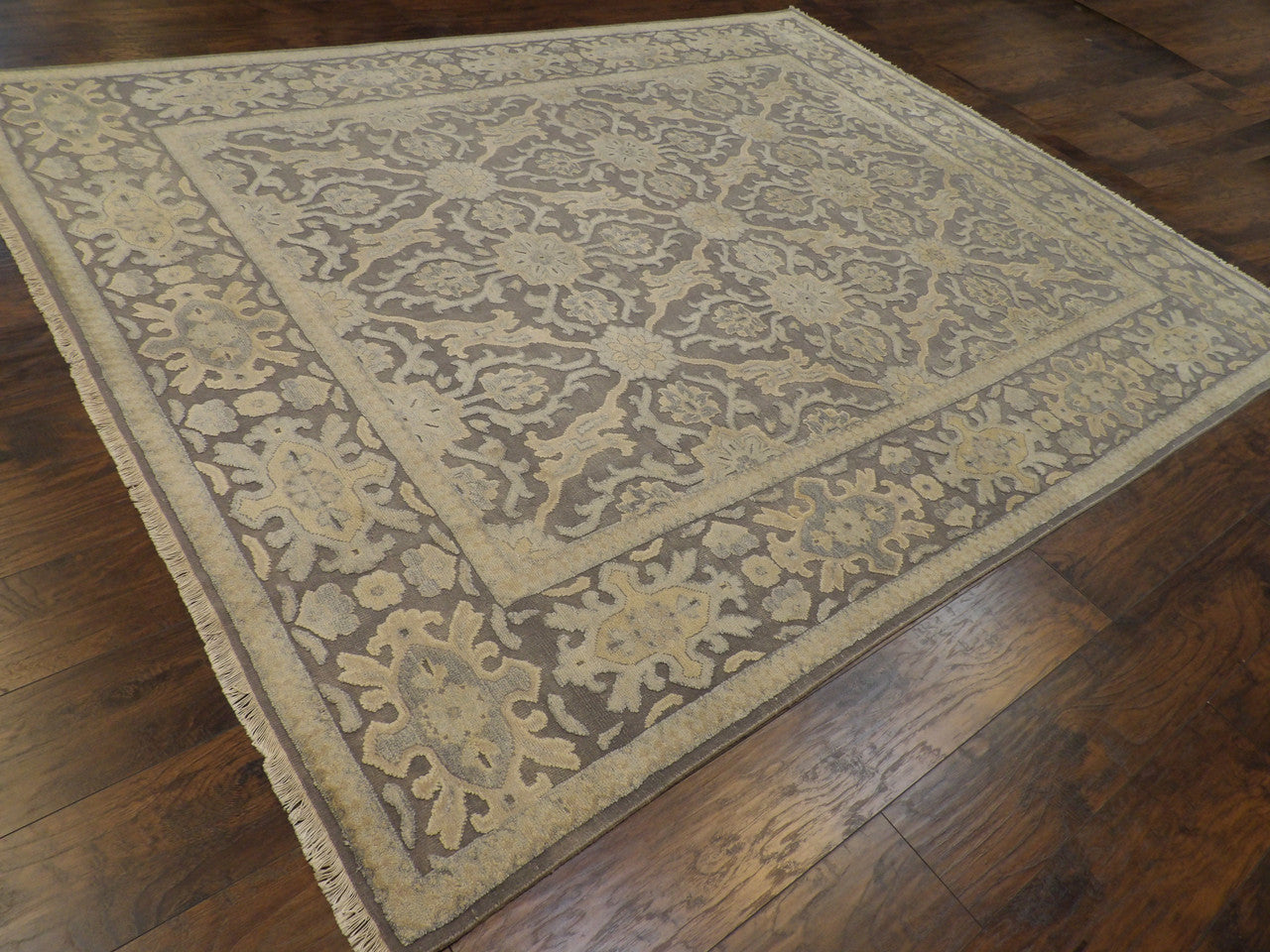 Gray and beige Oushak rug in a living room setting