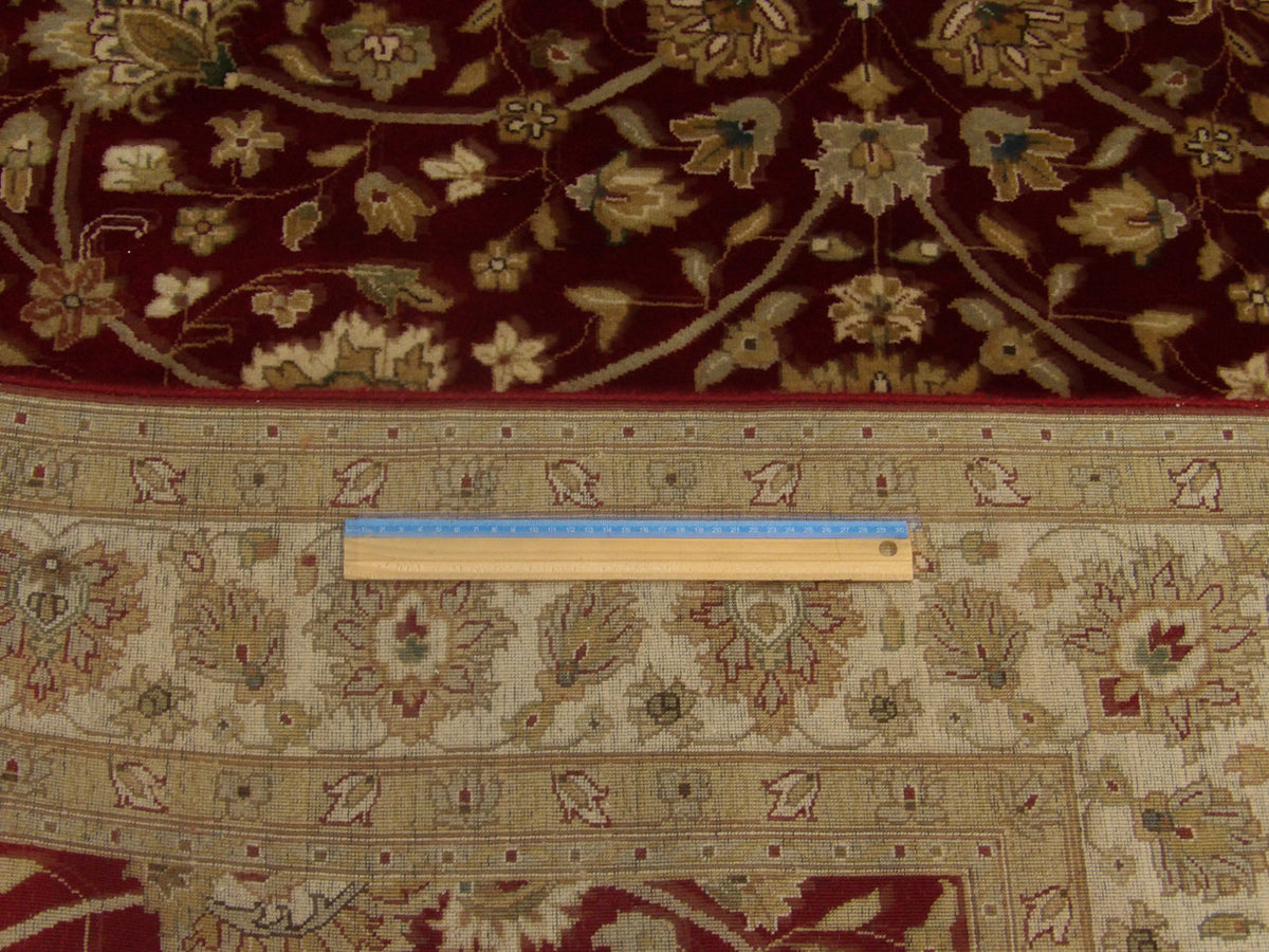 Beige and red Haji Jalili rug in room setting