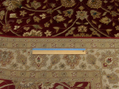 Beige and red Haji Jalili rug in room setting
