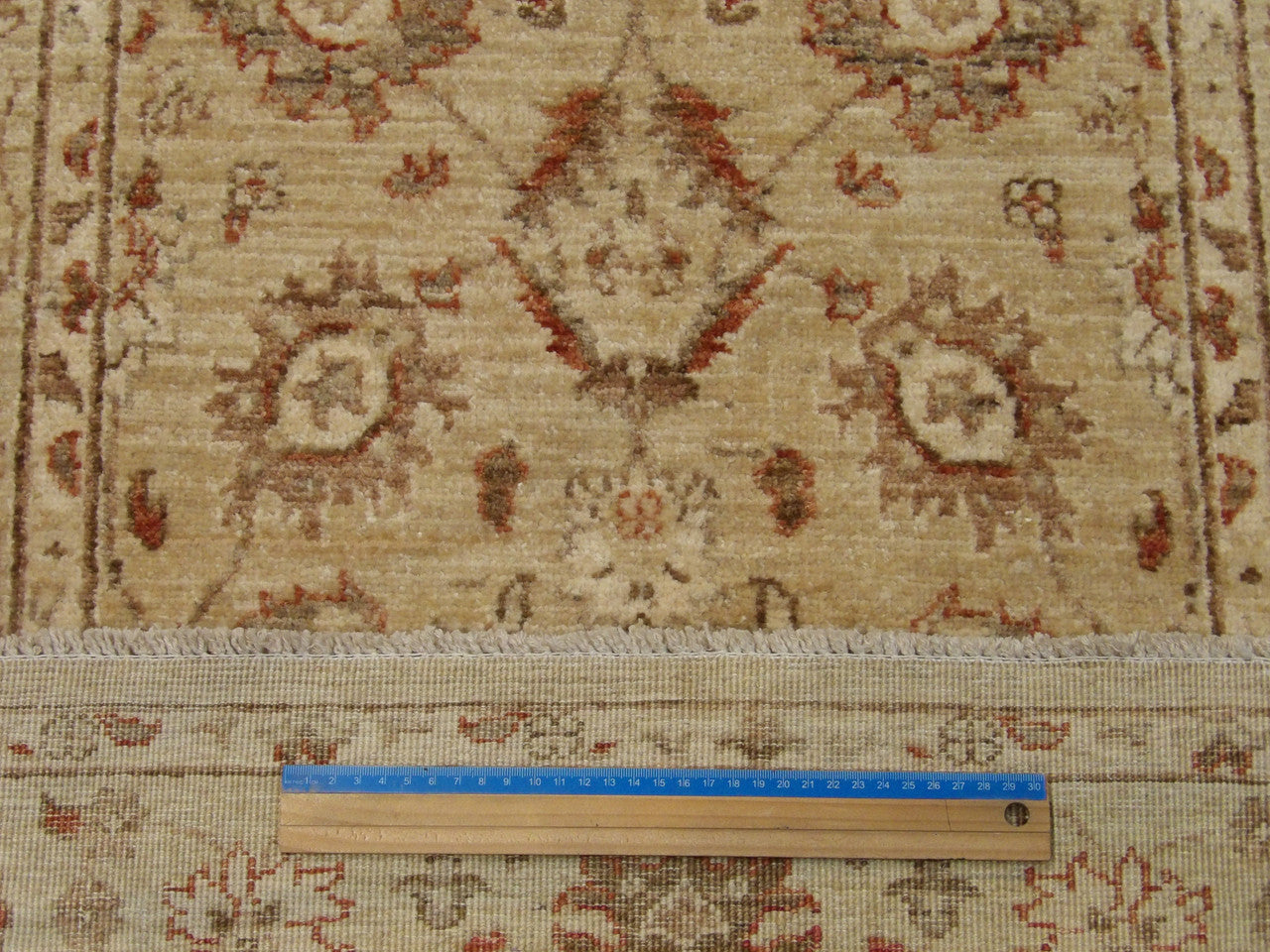Gold and beige Oushak runner in hallway setting