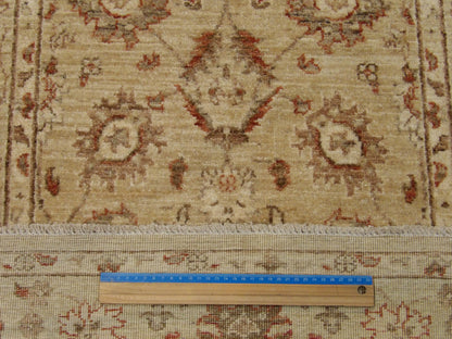 Gold and beige Oushak runner in hallway setting
