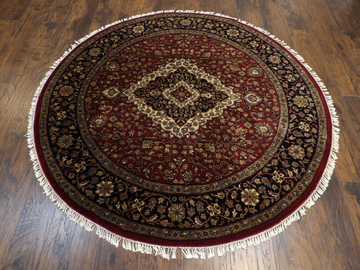 Close-up of wool pile, black round rug