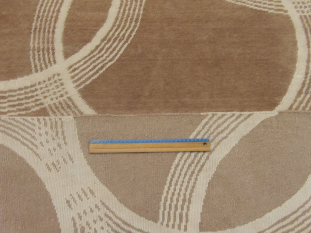 Beige & Purple Modern Nepalese Circle Design rug in room setting