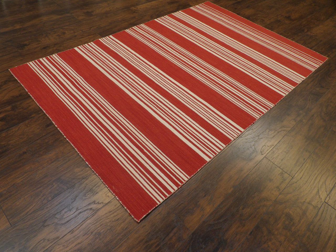 Flatweave pattern detail, beige and red coastal rug