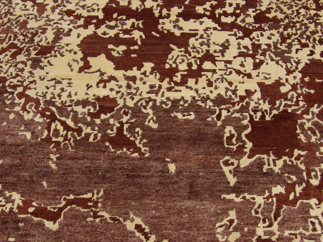 Modern mosaic rug border detail, beige and rust