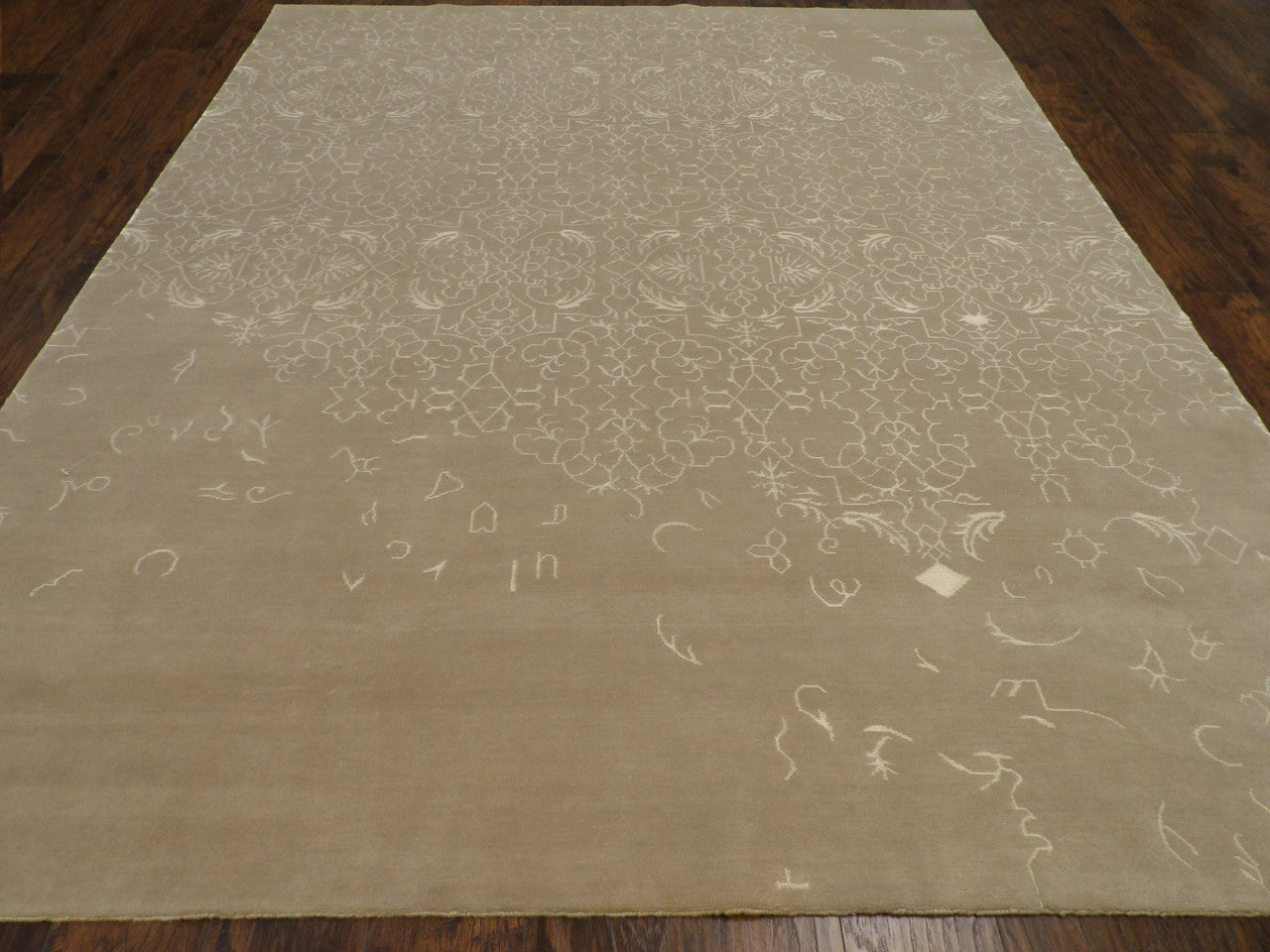 Broken pattern detail, gray and beige rug