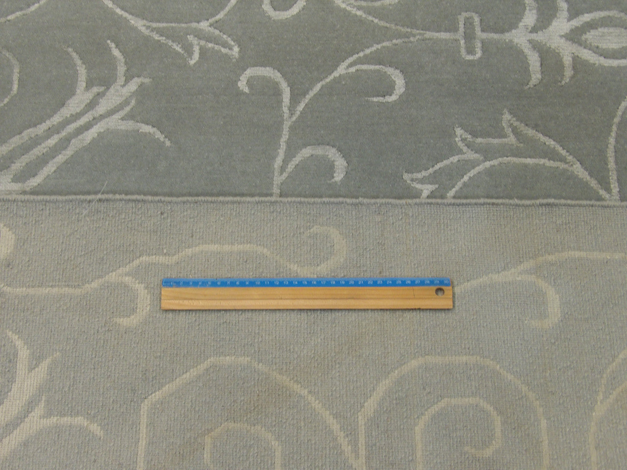 Full room view of transitional floral hand-knotted rug