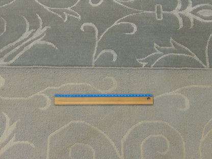Full room view of transitional floral hand-knotted rug
