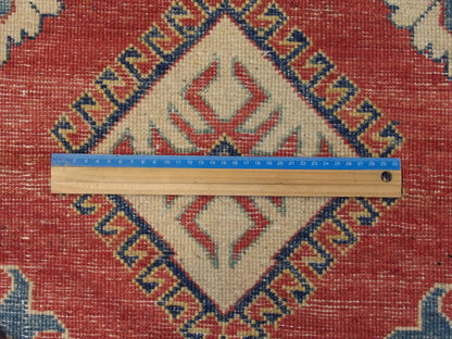 Beige & Red Tribal Super Kazak Natural Dye rug in room setting
