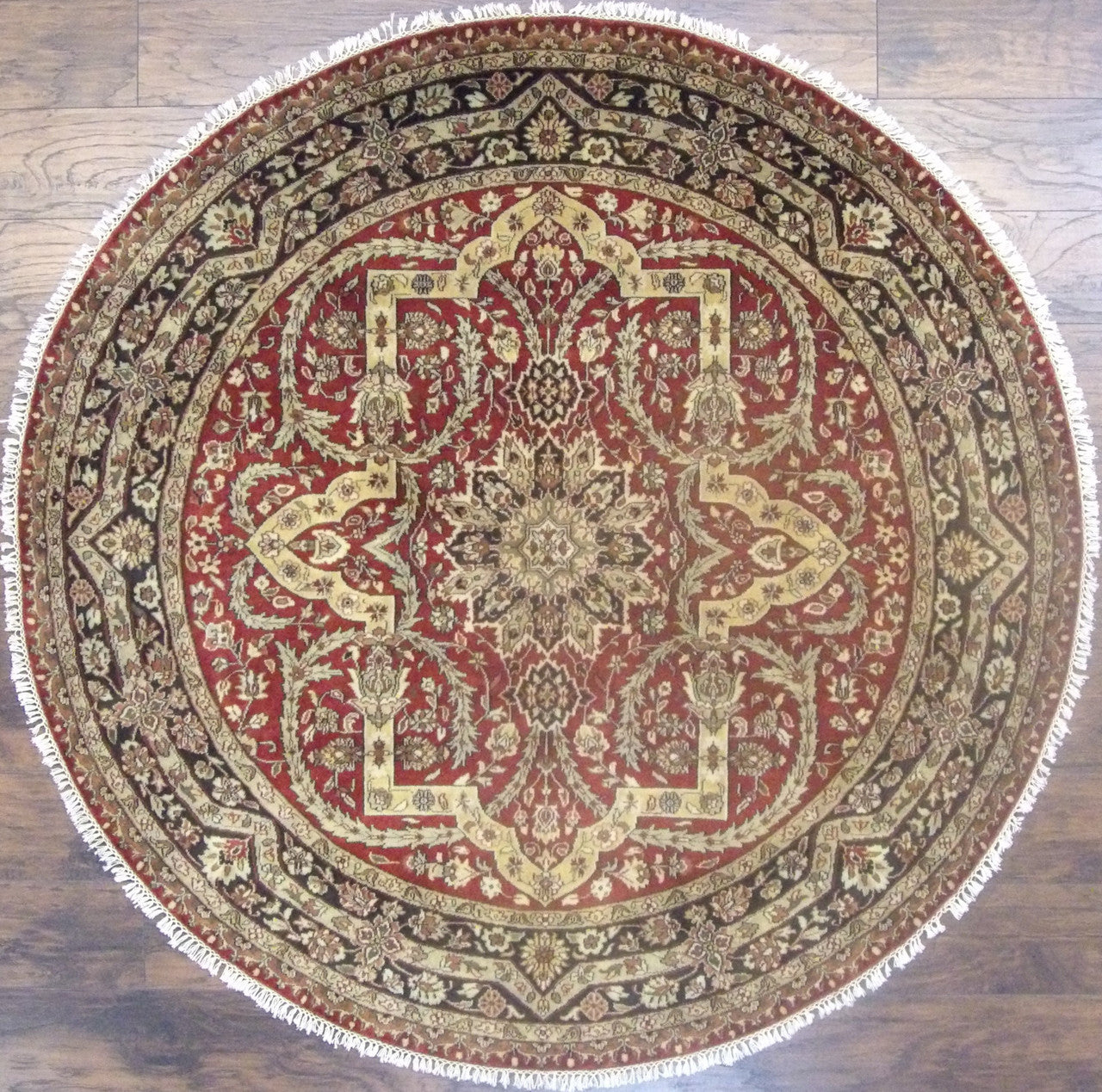 Persian Tabriz hand-knotted wool rug in black and red, round, full view
