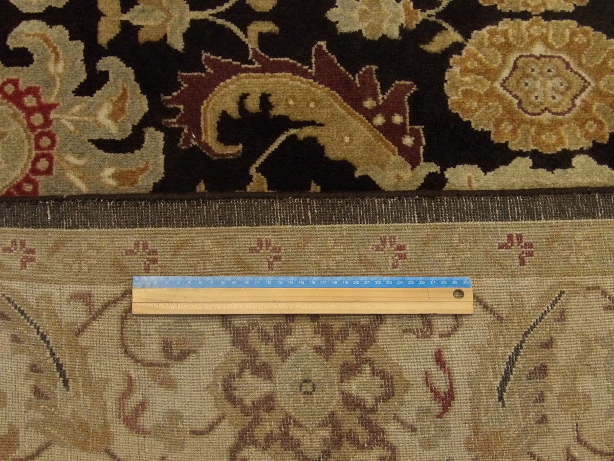 Beige & Purple Fine Persian Kashan rug in room setting