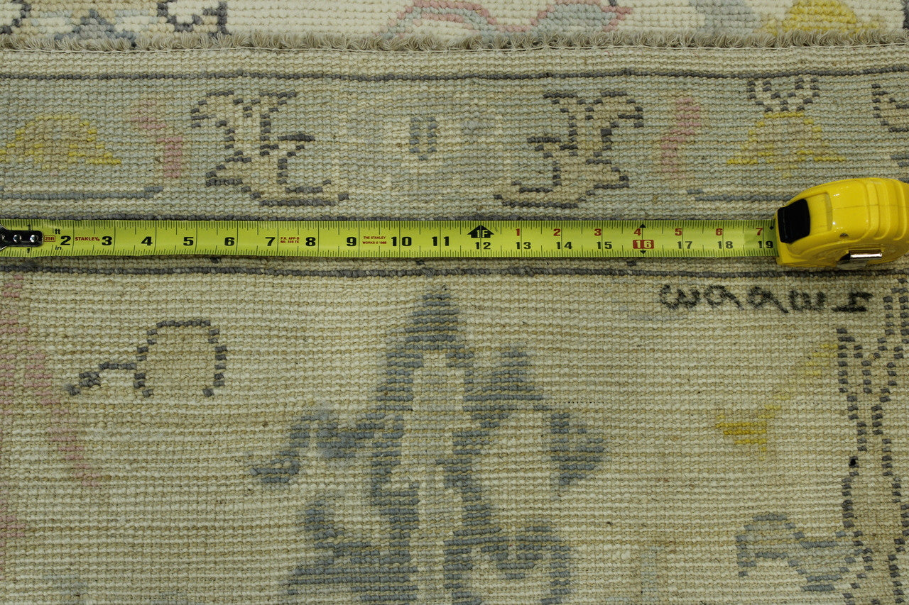 Green & Beige Oushak Chobi rug in room setting
