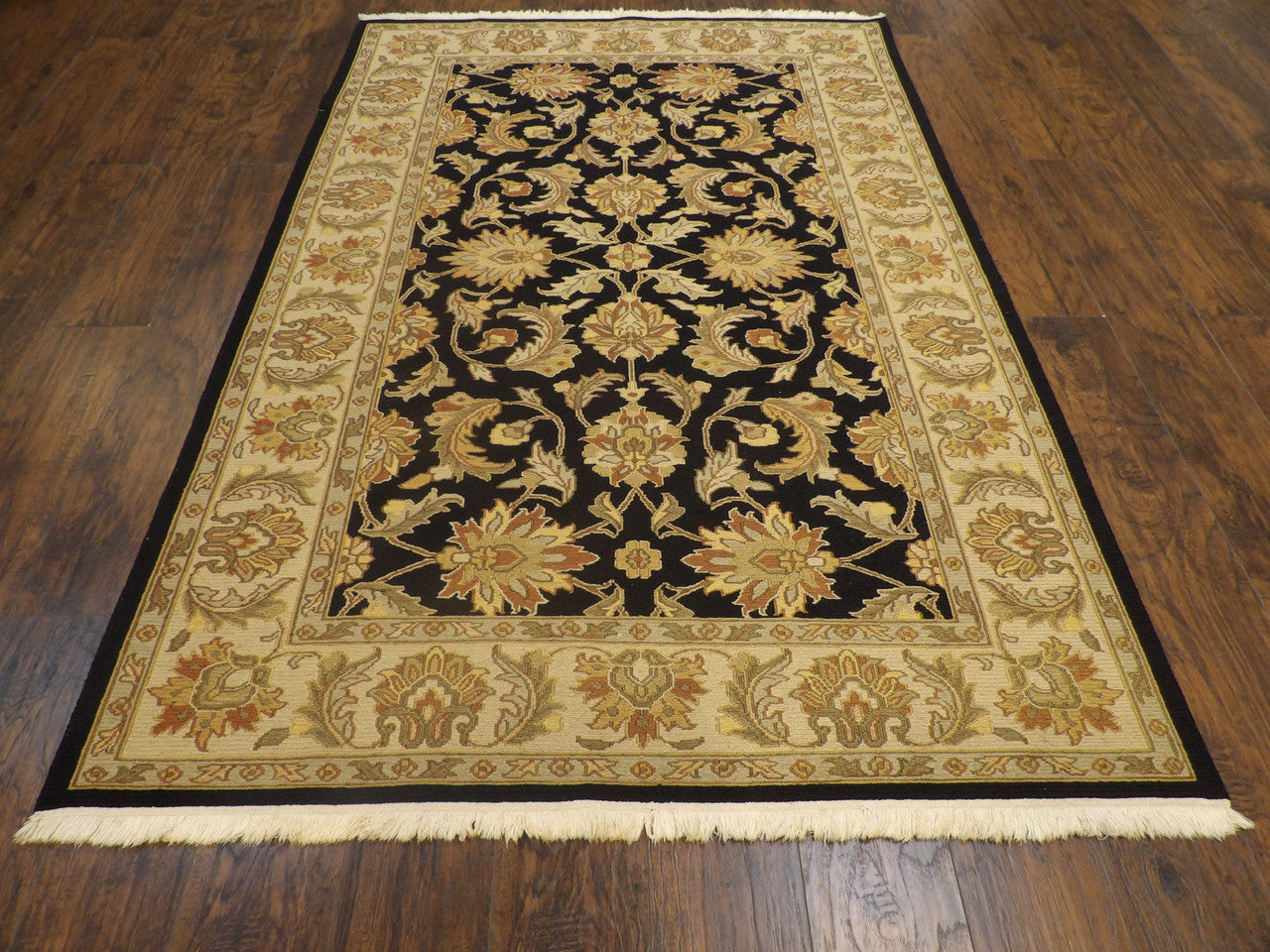 Close-up of flat weave texture, black and gold rug