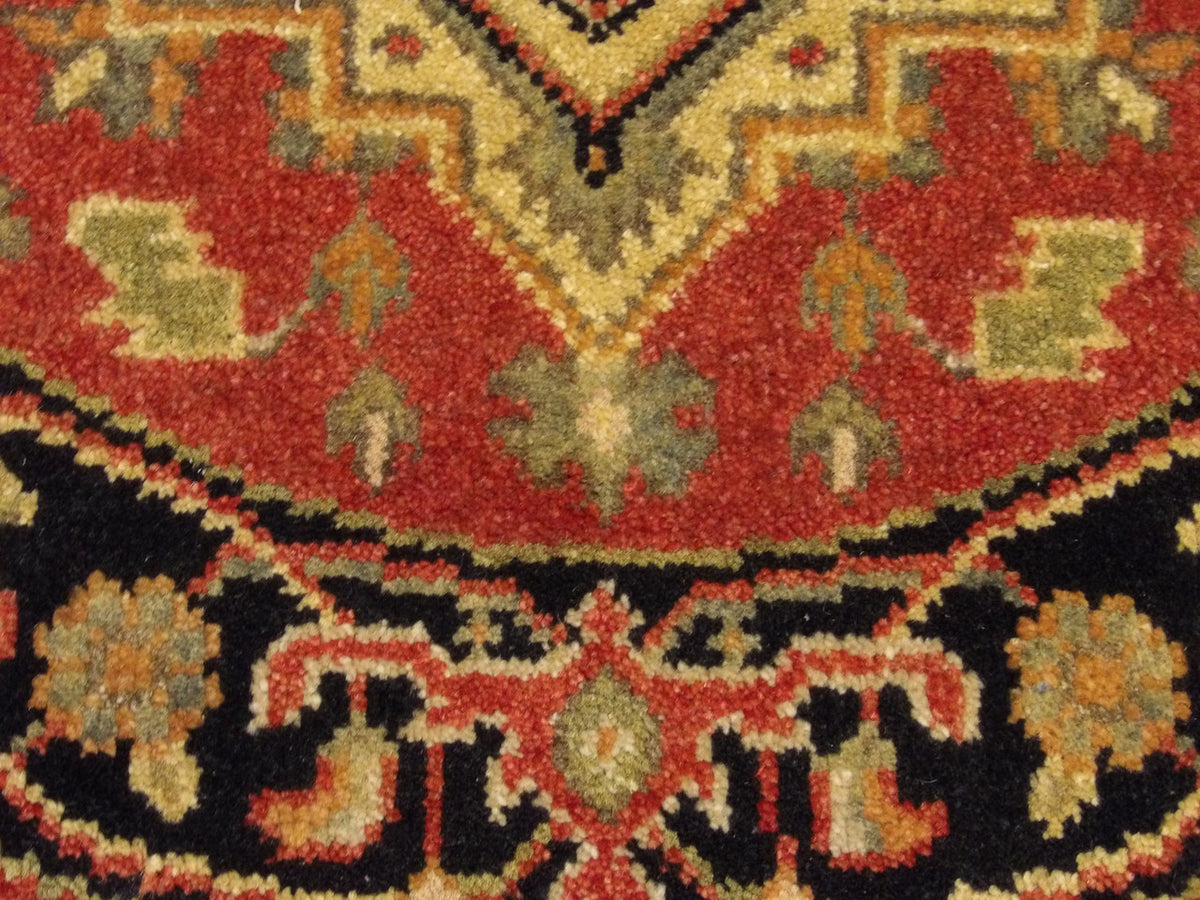 Tribal Heriz rug border detail
