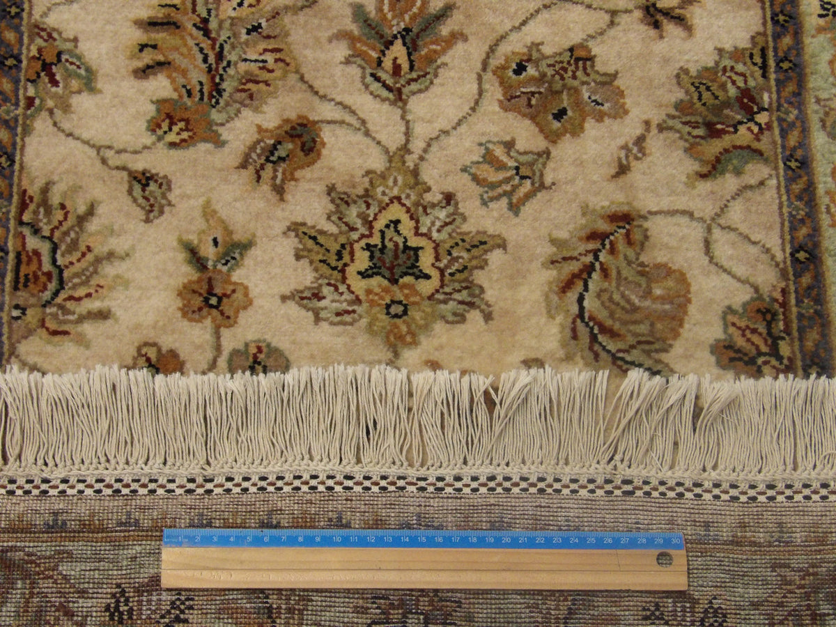 Green & Beige Fine Jaipur Kashan Tie Dye rug in room setting