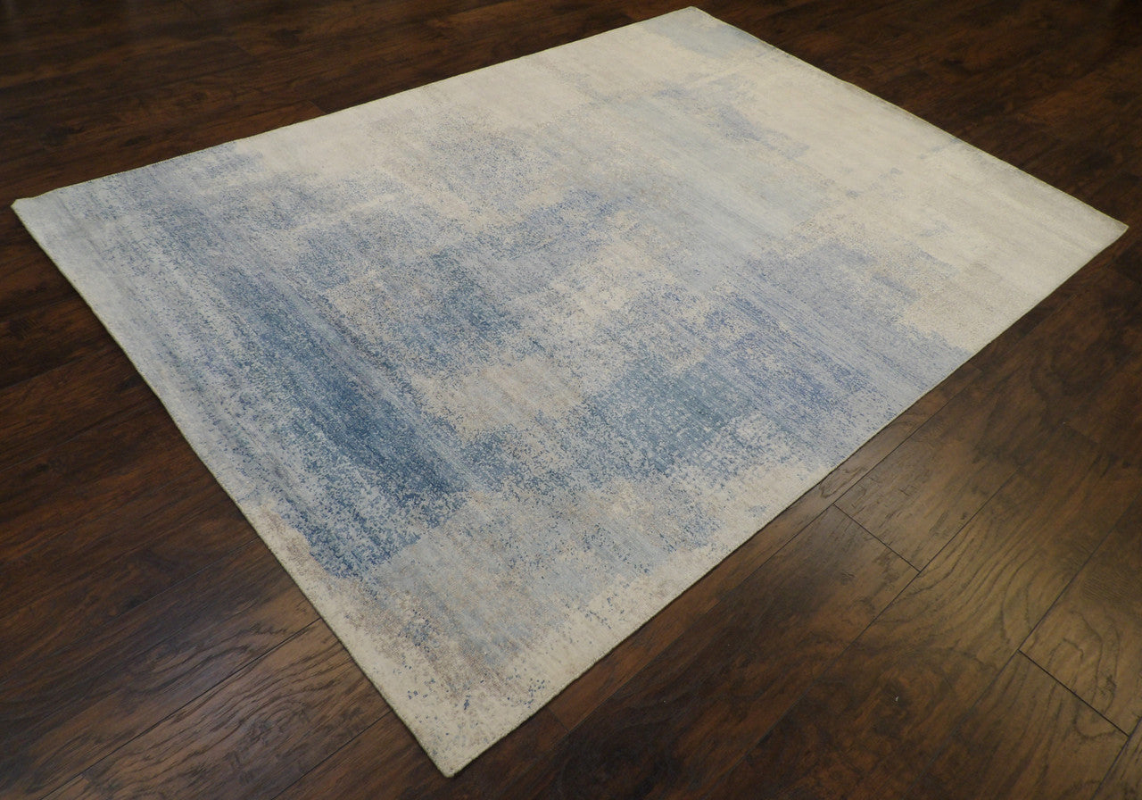 Oxidized abstract pattern detail, blue and brown wool-silk rug