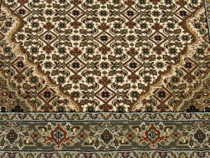 Fine Persian Tabriz rug border detail