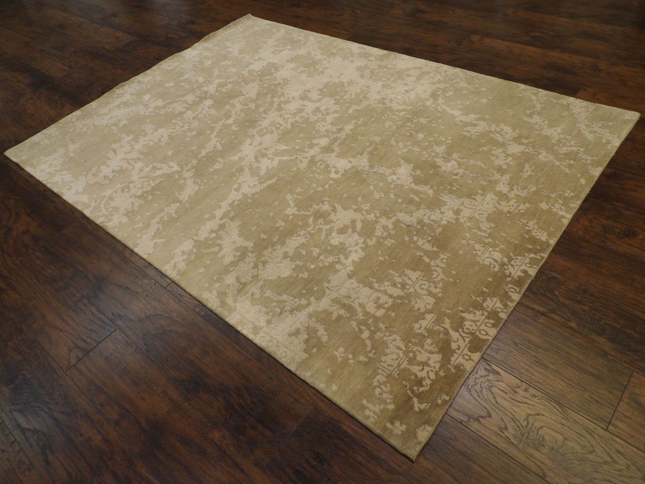 Beige and gray broken damask rug in a living room setting