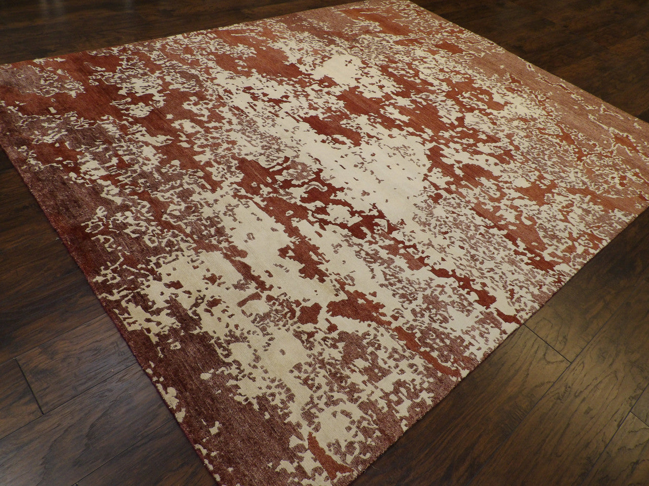 Mosaic pattern detail, beige and rust rug
