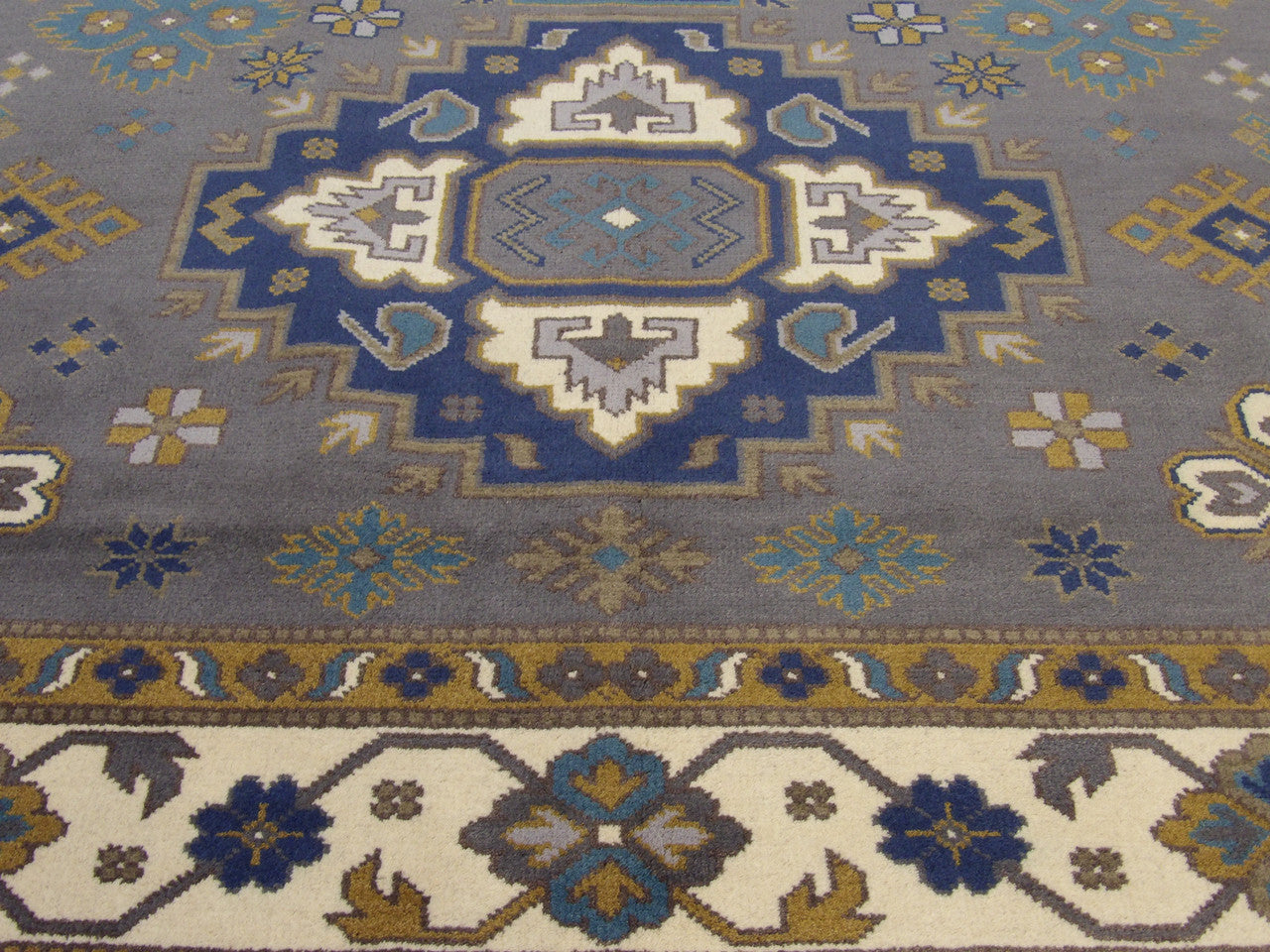 Tribal Kazak rug border detail