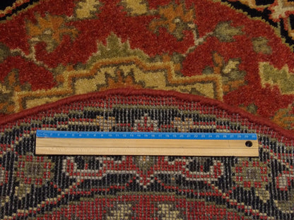 Black & Red Tribal Heriz rug in room setting
