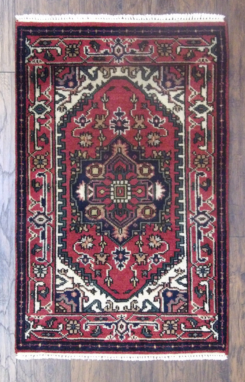 Tribal Persian Heriz hand-knotted wool rug in red, full view, 2x4