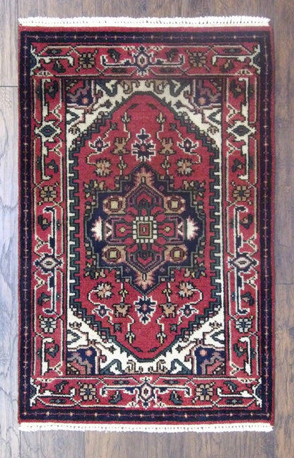 Tribal Persian Heriz hand-knotted wool rug in red, full view, 2x4