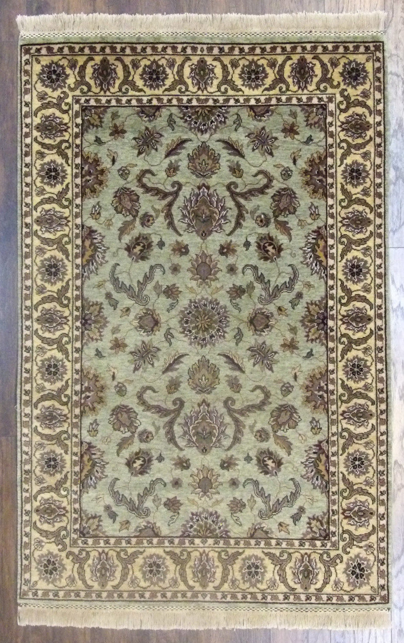 Fine Persian Kashan tie-dye hand-knotted wool rug in gold and green, full view