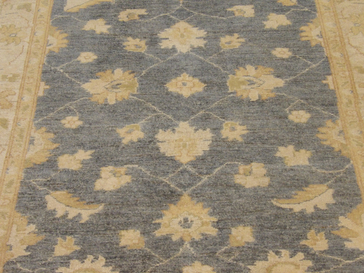 Gray and ivory Chobi rug in room setting