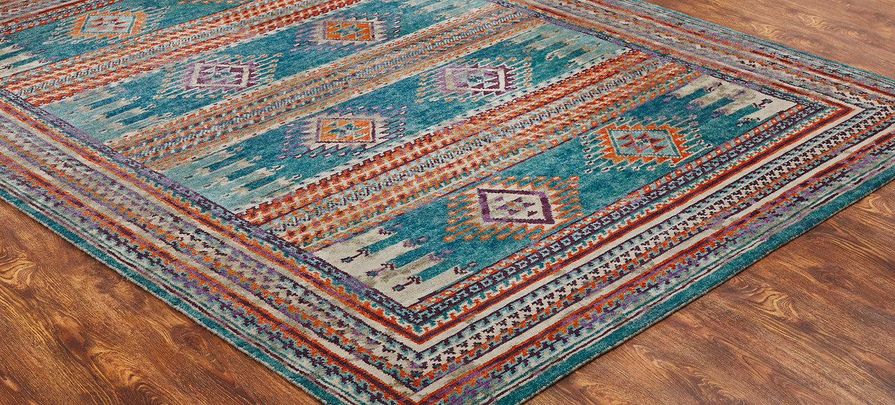 Transitional wool rug in blue and rust, detail view
