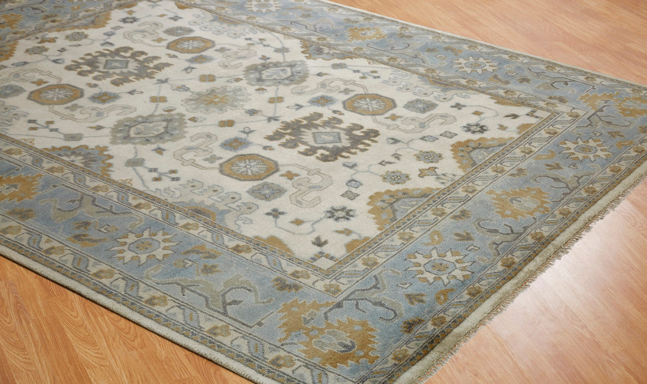 Beige and blue transitional wool rug in room setting