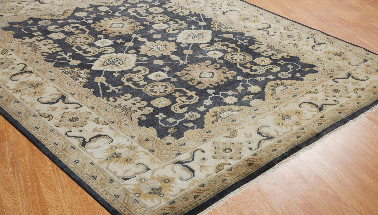 Black and beige transitional wool rug in room setting