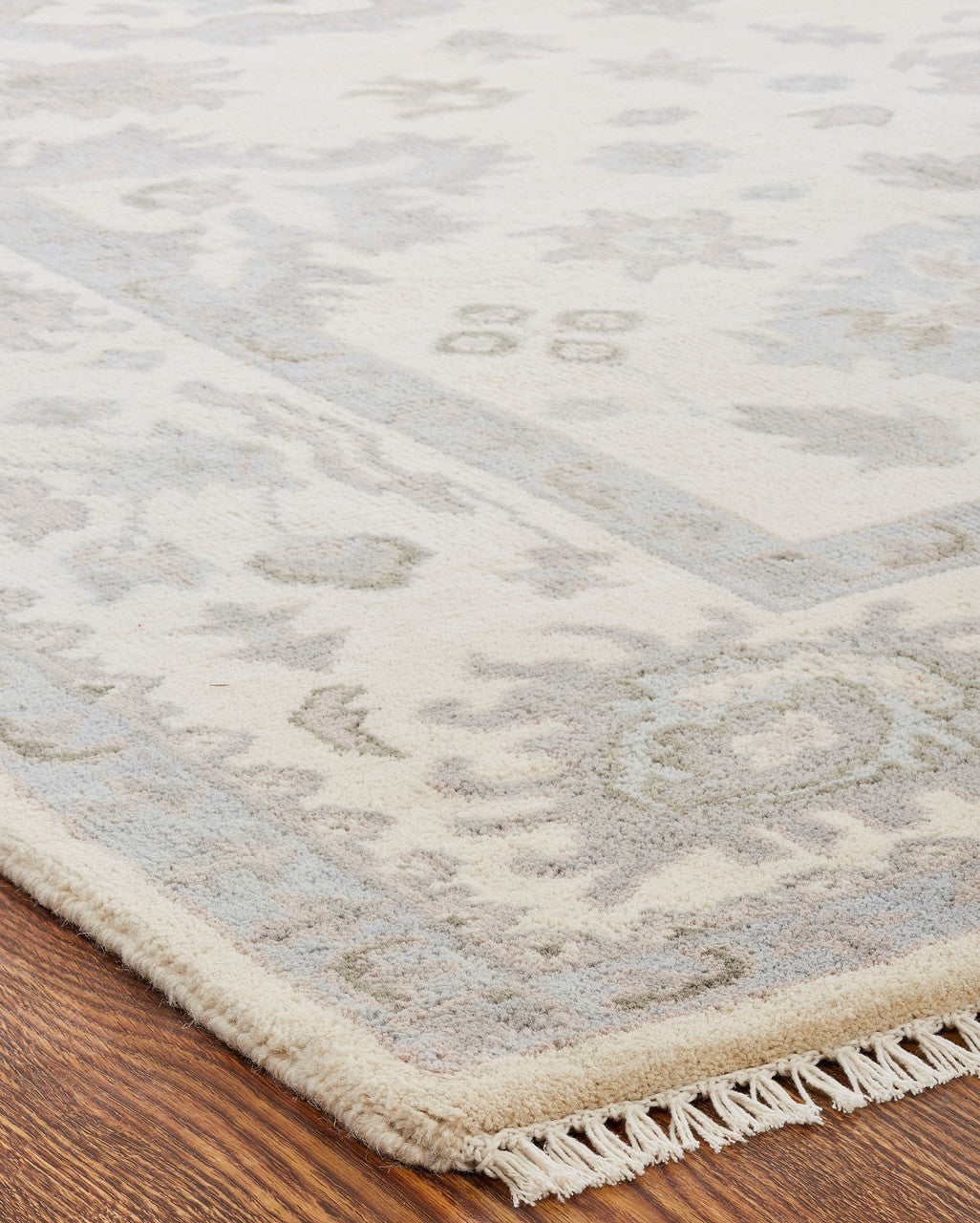 Off-white and gray transitional wool rug in room setting