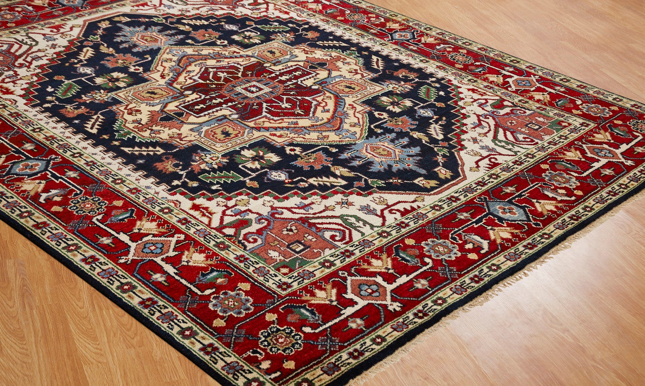 Red and black traditional wool rug in room setting