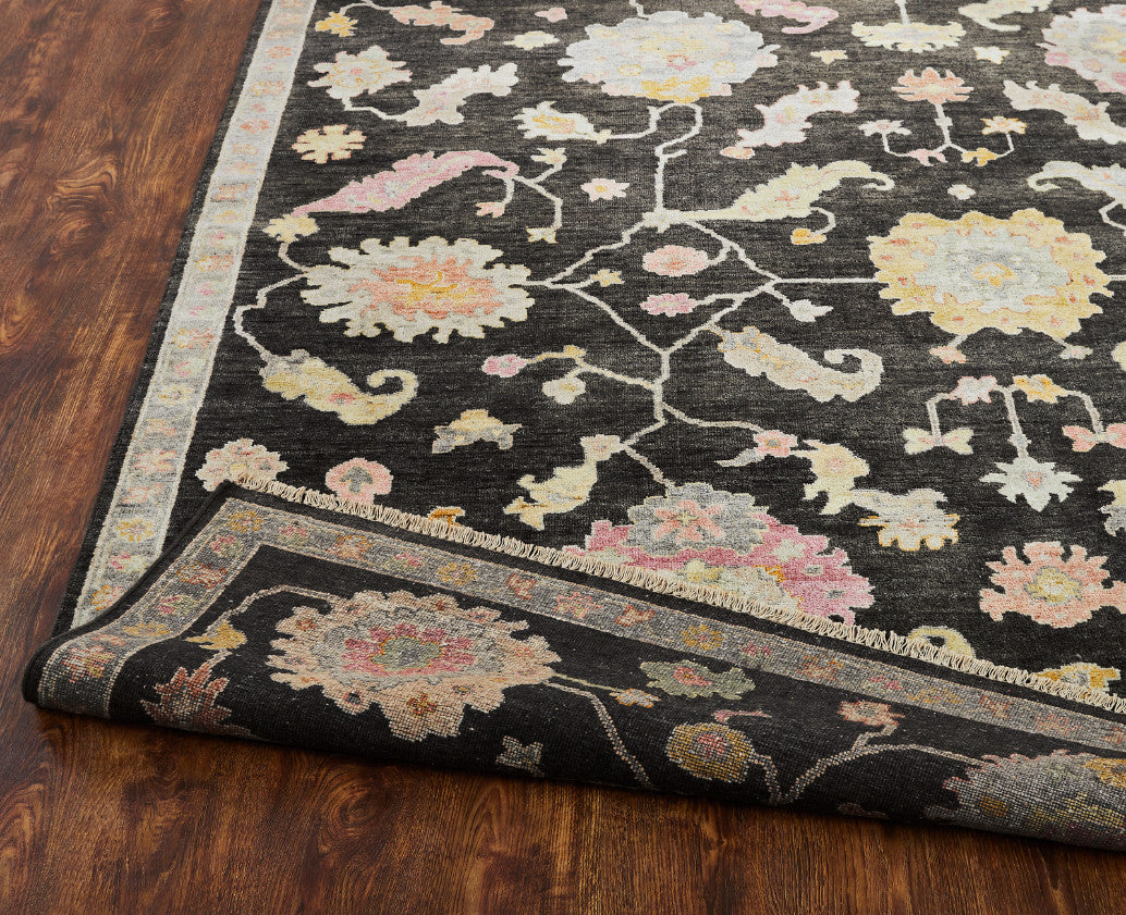 Black and gray transitional wool-silk rug in room setting