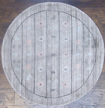 Modern Persian Gabbeh hand-knotted wool round rug in black and gray, full view