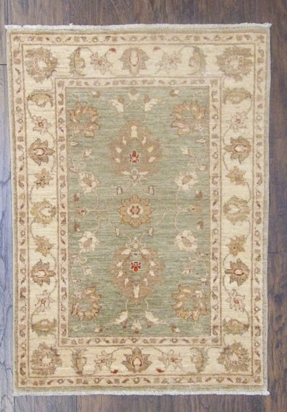 Oushak Chobi Natural Dye hand-knotted wool rug in Green & Beige, full view